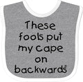 inktastic These Fools Put My Cape on Backwards Baby Bib by Inktastic