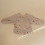 mushie Long Sleeve Baby Bib | Water Resistant Adjustable Fit - Image 3